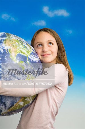 Little Girl Holding a Model of Earth as Seen From Outer Space