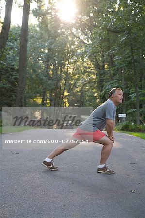 Man Stretching Before Morning Run