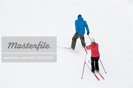 Backview Couple Cross Country Skiing, Whistler, British Columbia, Canada