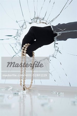Hand Stealing Pearl Necklace