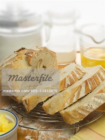 White Bread on Cooling Rack With Baking Ingredients