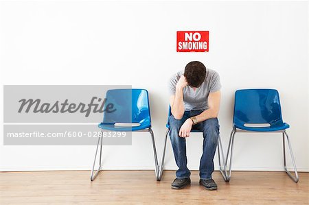 Man Sitting in Waiting Room