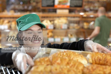 Baker Handling Tray of Baked Goods