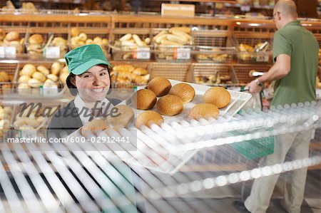 Baker Handling Tray of Baked Goods