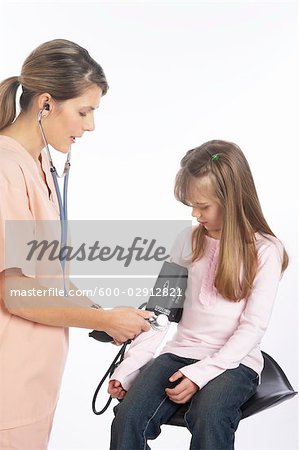 Nurse Testing Child's Blood Pressure