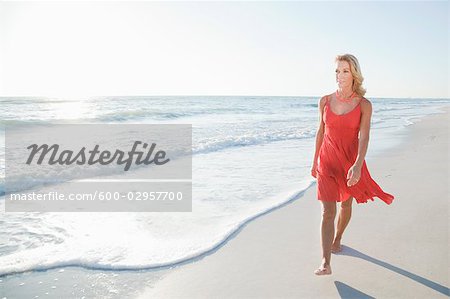 Woman Walking on Beach, Florida, USA