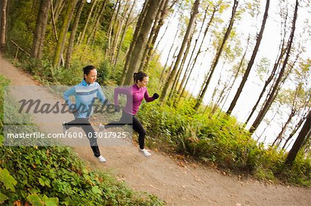 Women Running on Forest Trail, Seattle, Washington, USA