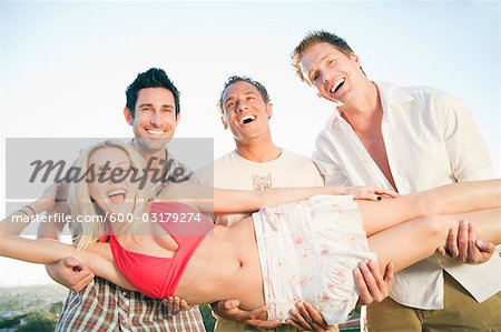 Three Men Picking up Woman