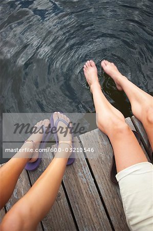 Two Teenage Girls Sitting on Dock, Near Portland, Oregon, USA