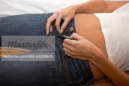 female hand unzips jeans zipper close up Stock Photo - Alamy