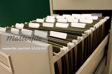 Close Up Of Files In Filing Cabinet Stock Photo Masterfile