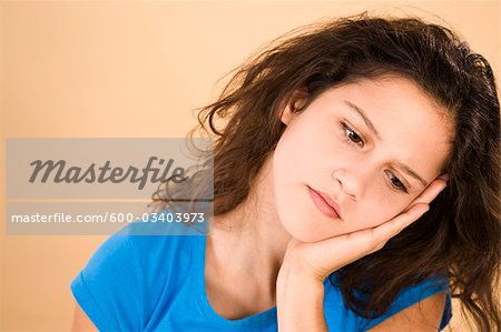 Teenage Girl Leaning Head on Hand