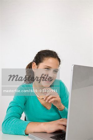 Teenage Girl Using Laptop