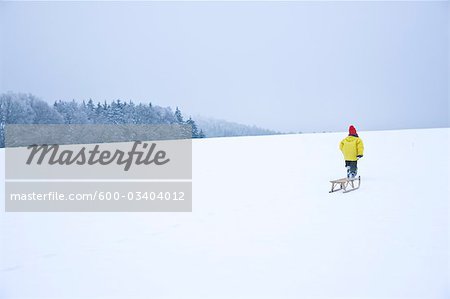 Boy Pulling Toboggan