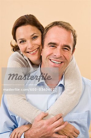 Couple with Arms Around Each Other