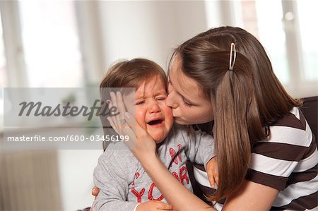 boy hugging crying girl