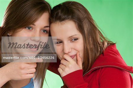 Two Friends Telling a Secret