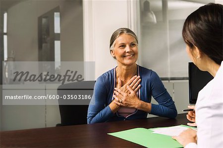 Woman Talking to Doctor