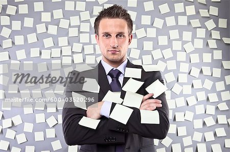 Businessman Covered in Self Adhesive Notes