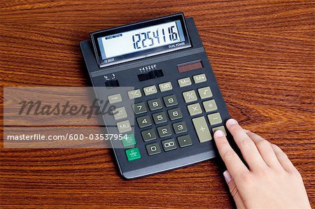Woman Using Calculator