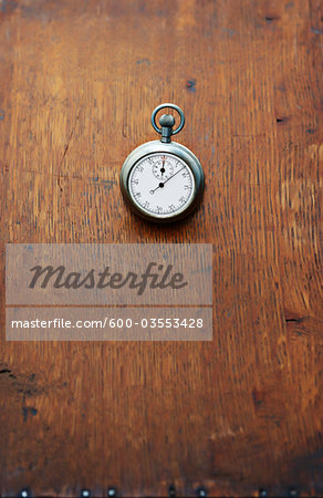 Close-up of Stopwatch on Wooden Surface