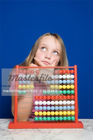 Young Girl Counting With Abacus