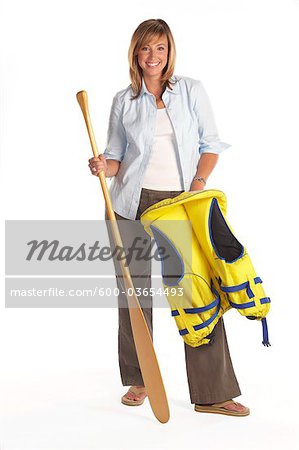 Portrait of Woman Wearing a Life Jacket and Holding a Canoe Paddle