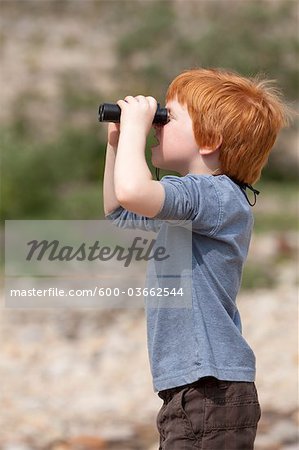 Boy Looking through Binoculars, Jasper National Park, Alberta, Canada