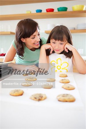 Mother and Daughter Baking Cookies, Portland, Oregon, USA