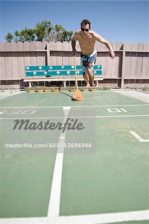Man Playing Shuffleboard in Trailer Park, Yuma, Yuma County, Arizona, USA