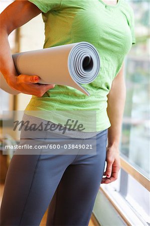 Close-up of Woman holding Yoga Mat, Seattle, Washington, USA