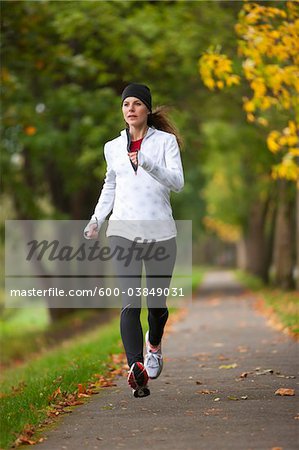 Woman Jogging through Park, Seattle, Washington, USA