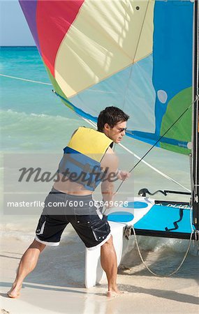 Man with Catamaran, Reef Playacar Resort and Spa Hotel, Playa del Carmen, Quintana Roo, Yucatan Peninsula, Mexico