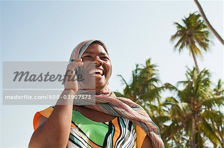 Woman Using Cell Phone, Nyota Beach, Unguja, Zanzibar, Tanzania Woman Using Cell Phone, Nyota Beach, Unguja, Zanzibar, Tanzania