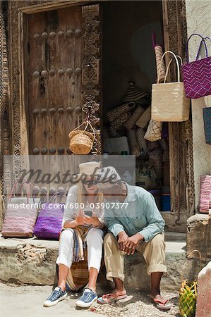 Basket Seller with Tourist, Stone Town, Unguja, Zanzibar, Tanzania Basket Seller with Tourist, Stone Town, Unguja, Zanzibar, Tanzania