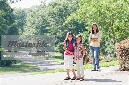 Mother and Daughters Walking Home from School