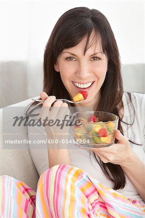 Close-up of Woman Eating Bowl of Fruit