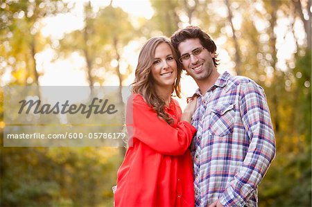 Portrait of Young Couple in Park