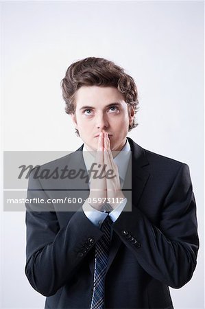 Young Businessman Praying