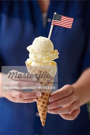 Woman Holding Vanilla Ice Cream Cone with American Flag