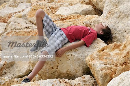 Boy Lying on Rocks, Ile de Re, France