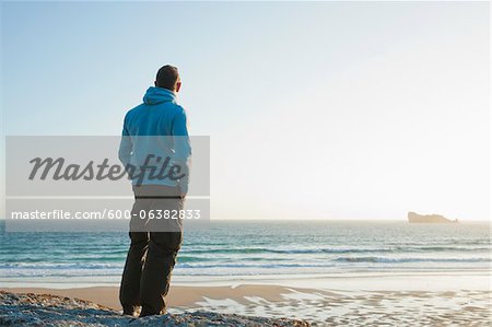 Man Looking into the Distance at the Beach, Camaret-sur-Mer, Crozon Peninsula, Finistere, Brittany, France
