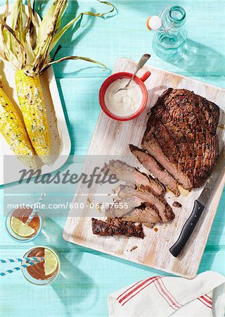 Flank Steak, Corn on the Cob and Glasses of Iced Tea Flank Steak, Corn on the Cob and Glasses of Iced Tea