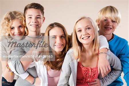 Portrait of Group of Teenage Boys and Girls Smiling at Camera, Studio Shot  on White Background - Stock Photo - Masterfile - Premium Royalty-Free,  Artist: Uwe Umstätter, Code: 600-06438963