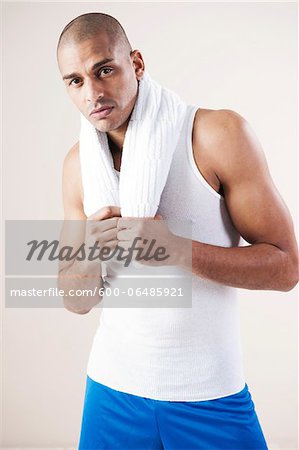 Man Wearing Work Out Clothes in Studio with White Background