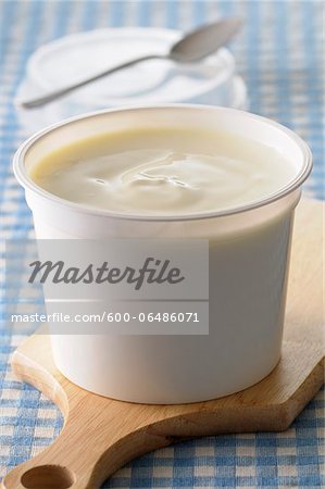 Close-up of Creme Fraiche on Cutting Board on Gingham Background, Studio Shot