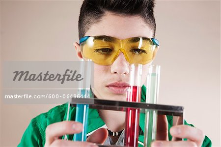 Boy wearing Safety Glasses with Test Tubes of Liquid, Mannheim, Baden-Wurttemberg, Germany