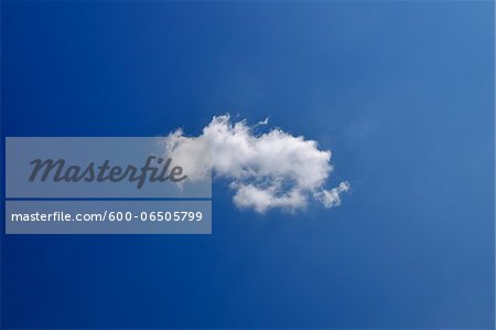 Puffy Cloud in Sky in Summer, Asciano, Province of Siena, Tuscany, Italy Puffy Cloud in Sky in Summer, Asciano, Province of Siena, Tuscany, Italy