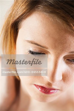 Close-up Portrait of Teenaged Girl Looking Downward