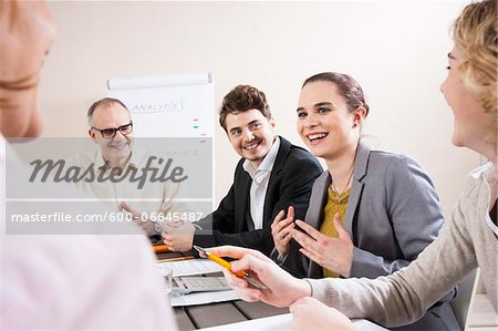 Group of Business People having Meeting in Boardroom